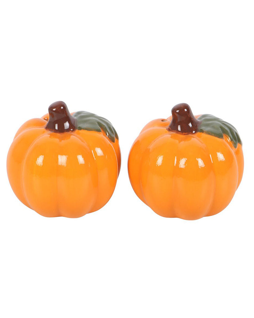 Pair of pumpkin-shaped ceramic salt and pepper shakers by Rebel Romance, displayed side by side. Both feature glossy orange bodies with brown stems and green leaves on top. Cute and quirky addition to Halloween or autumn kitchen décor.