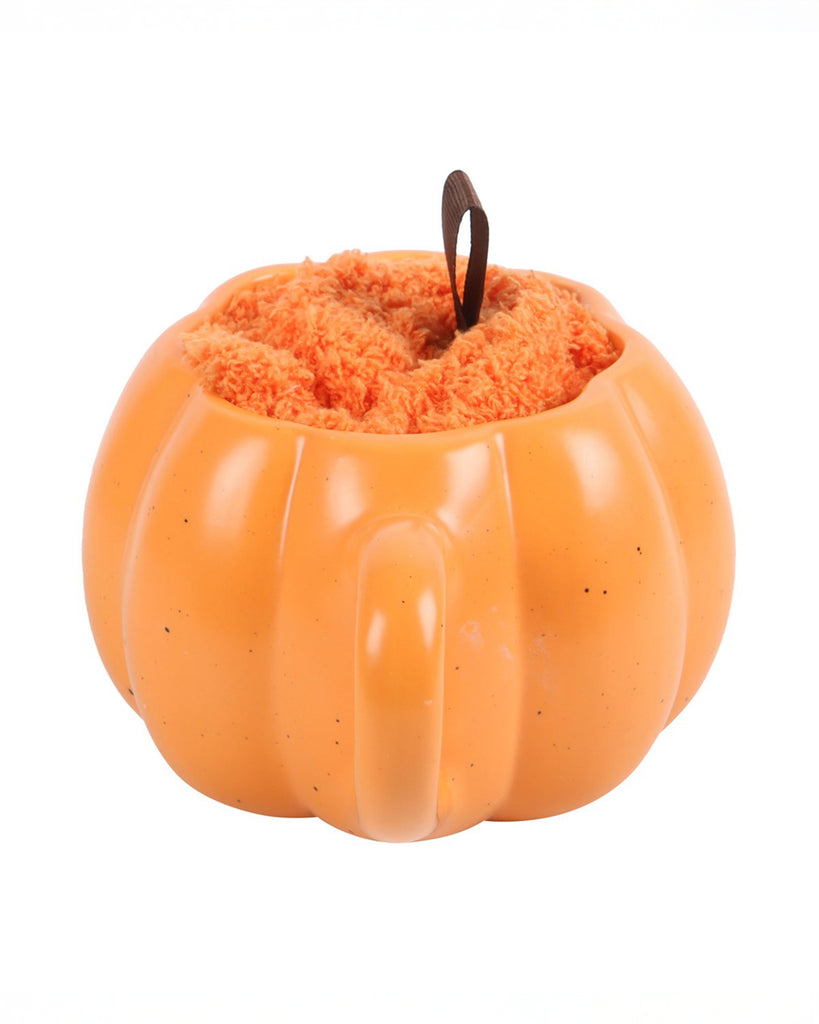 Front view of the pumpkin mug filled with orange fluffy socks, ribbon sticking out like a pumpkin stalk. Stocked at Rebel Romance for autumn lovers.