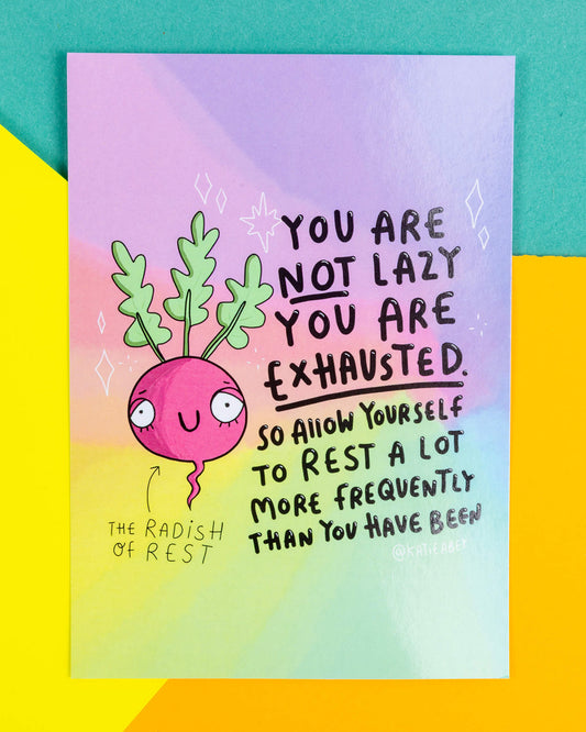 A colourful A6 postcard featuring a smiling pink radish with leafy green top and the message “You are not lazy, you are exhausted. So allow yourself to rest a lot more frequently than you have been.” Designed by Katie Abey and sold by Rebel Romance, this postcard promotes rest and self-compassion, printed on high-quality silk finish card.