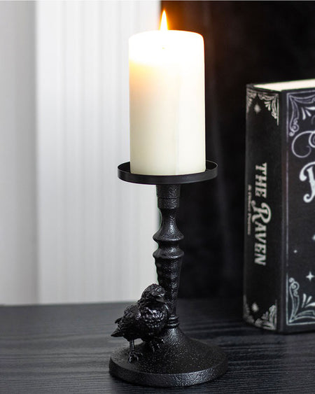 Close-up of Raven Candle Holder
Alt text: A close-up view of a black resin candle holder base featuring a detailed sculpt of a raven perched at the bottom, with a textured gothic-style finish.