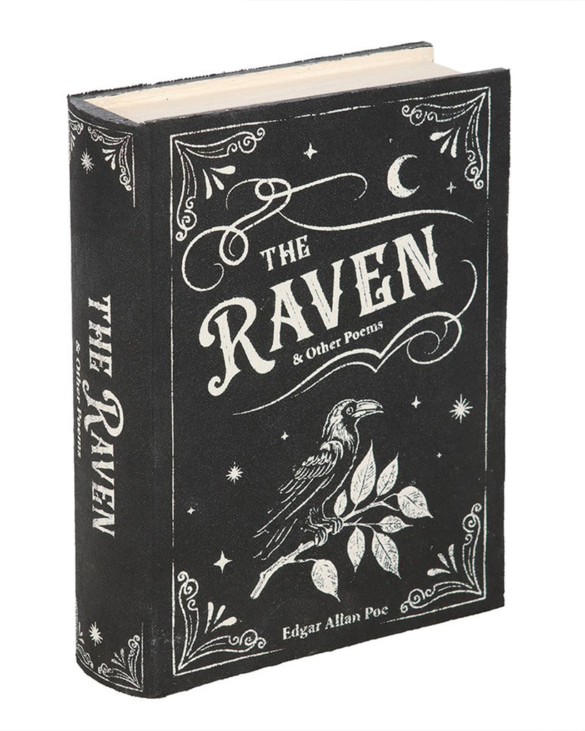 The front cover of the gothic-themed Raven storage box, styled like a classic book with vintage white artwork of a raven and decorative motifs. Rebel Romance offers this secret storage box for fans of dark literature and moody aesthetics.
