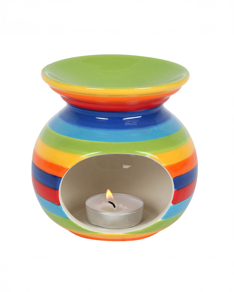 Front view of the Rainbow Stripe Oil Burner, showing the tealight cavity with a lit candle. The open bowl on top holds wax melts or fragrance oils.