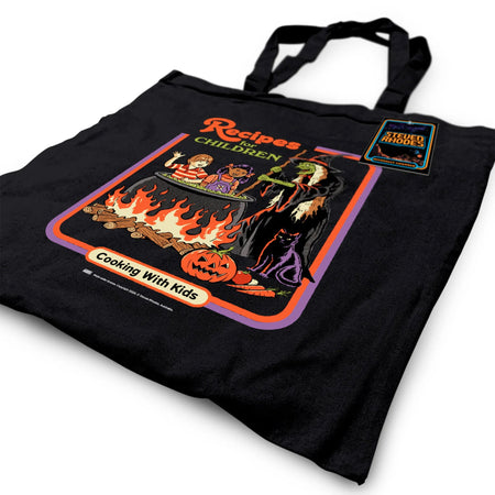 Close-up view of the “Recipes for Children” black tote bag showcasing its vibrant illustration and playful, dark humour design, lying flat for detail display.