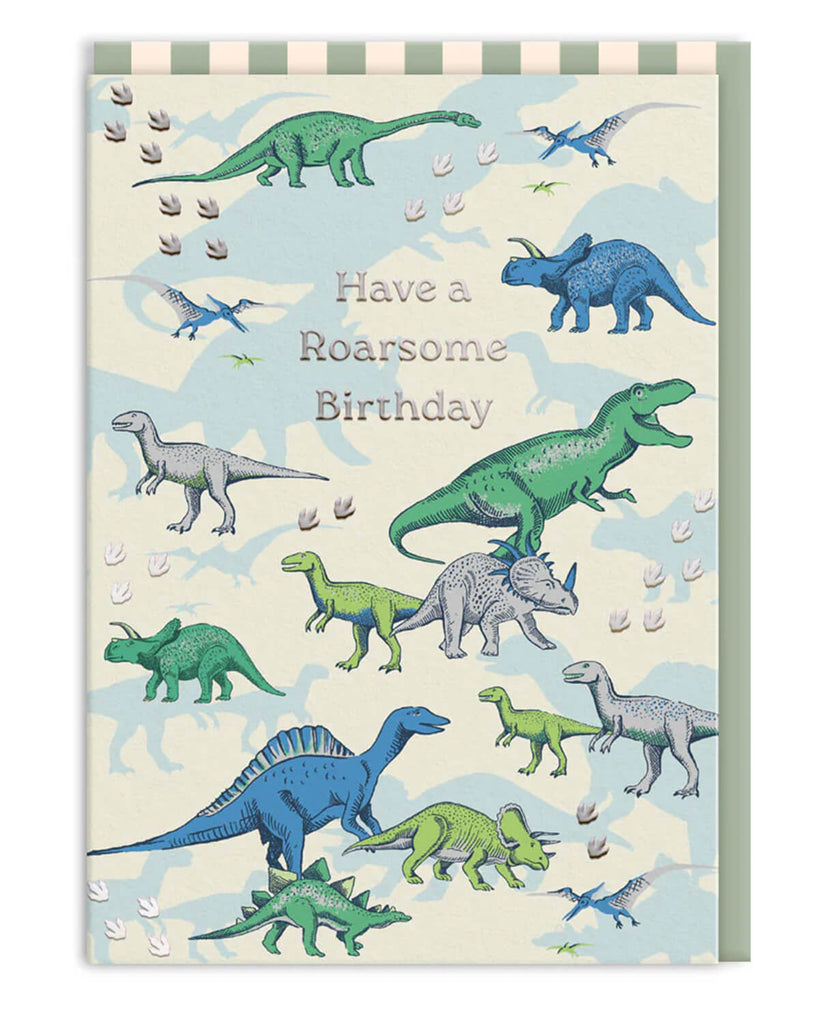 Cath Kidston dinosaur birthday card with silver foil text reading “Have a Roarsome Birthday”, featuring green and blue illustrated dinosaurs with a striped envelope. Ideal for kids and adults who love dinosaurs or novelty stationery.