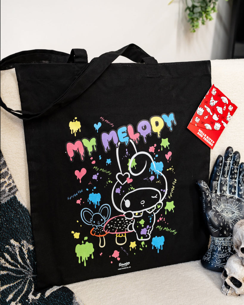 my melody Sanrio official tote bag in black with a cute white outline of My Melody with coloured paint splatters