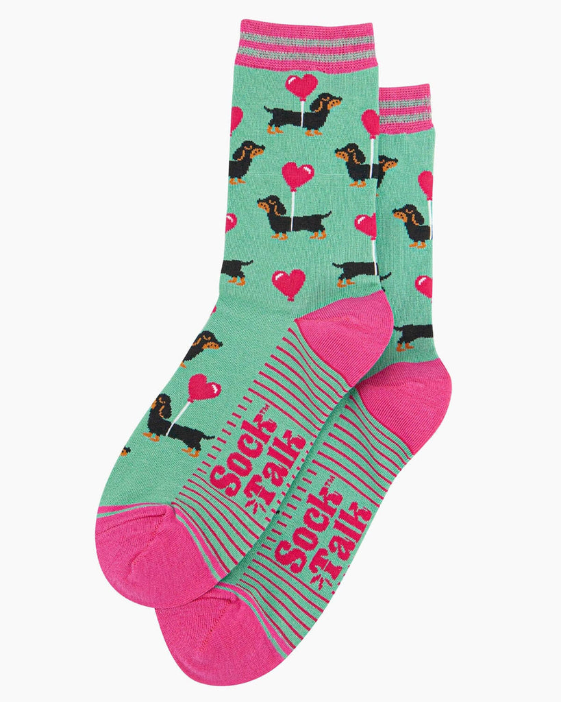 Side view of the sausage dog socks, highlighting the pink heel and toe accents.