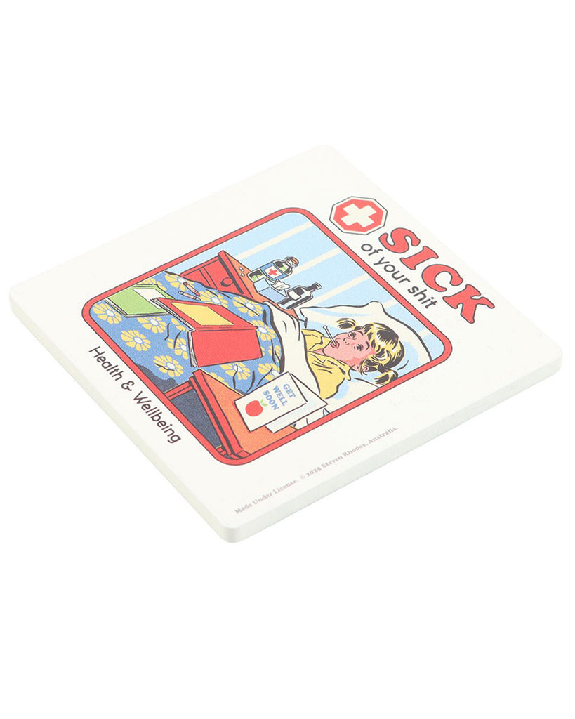 Angled view of Steven Rhodes “Sick of Your Shit” coaster, available at Rebel Romance. Humorous retro homeware featuring a sick girl illustration with medicine and books, perfect for alternative millennials.