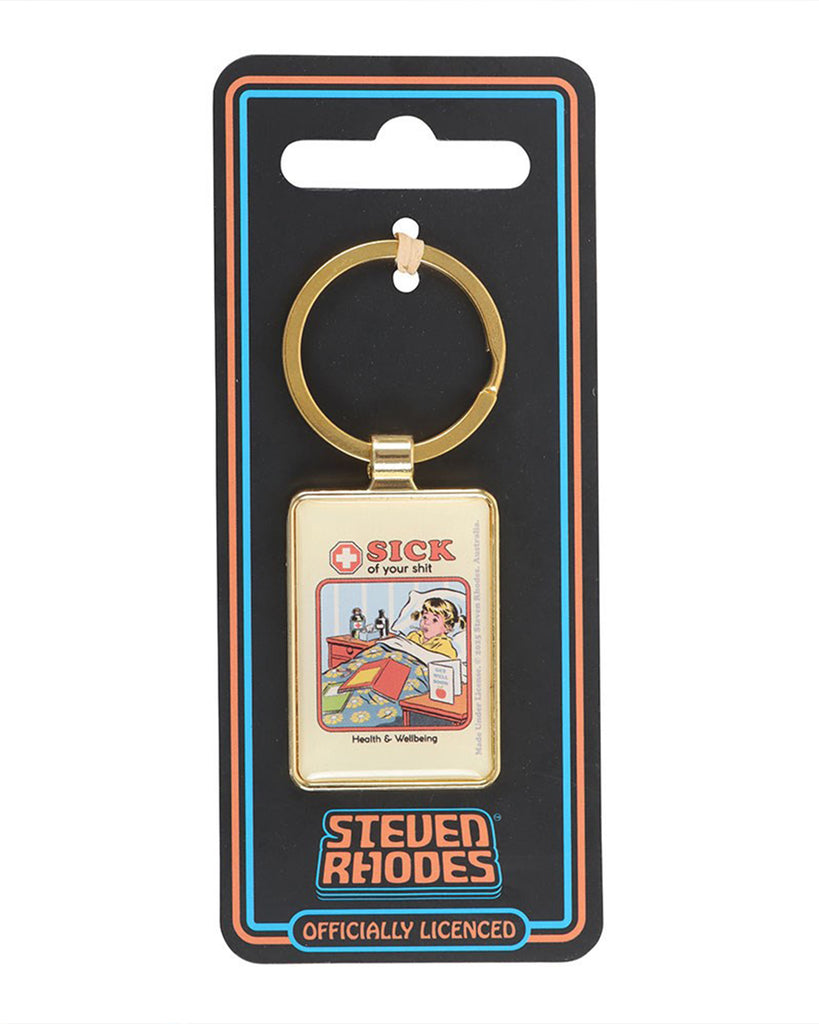 The Steven Rhodes “Sick of your shit” enamel keyring displayed on black backing card with official branding. Retro comic-style design with bold humour, sold by Rebel Romance, a UK small business for alternative fashion, homeware and gifts.