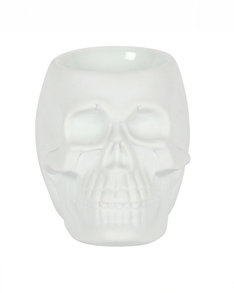 Front view of the White Skull Oil Burner, highlighting the detailed skull design with hollow eyes, cheekbones, and teeth. The top has a bowl for fragrance oils or wax melts.