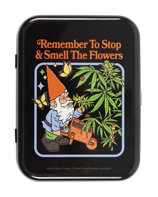 Front close-up of the Smell the Flowers stash tin by Steven Rhodes. The design shows a retro garden gnome sniffing a cannabis plant under the words “Remember To Stop & Smell The Flowers”. Sold by Rebel Romance.