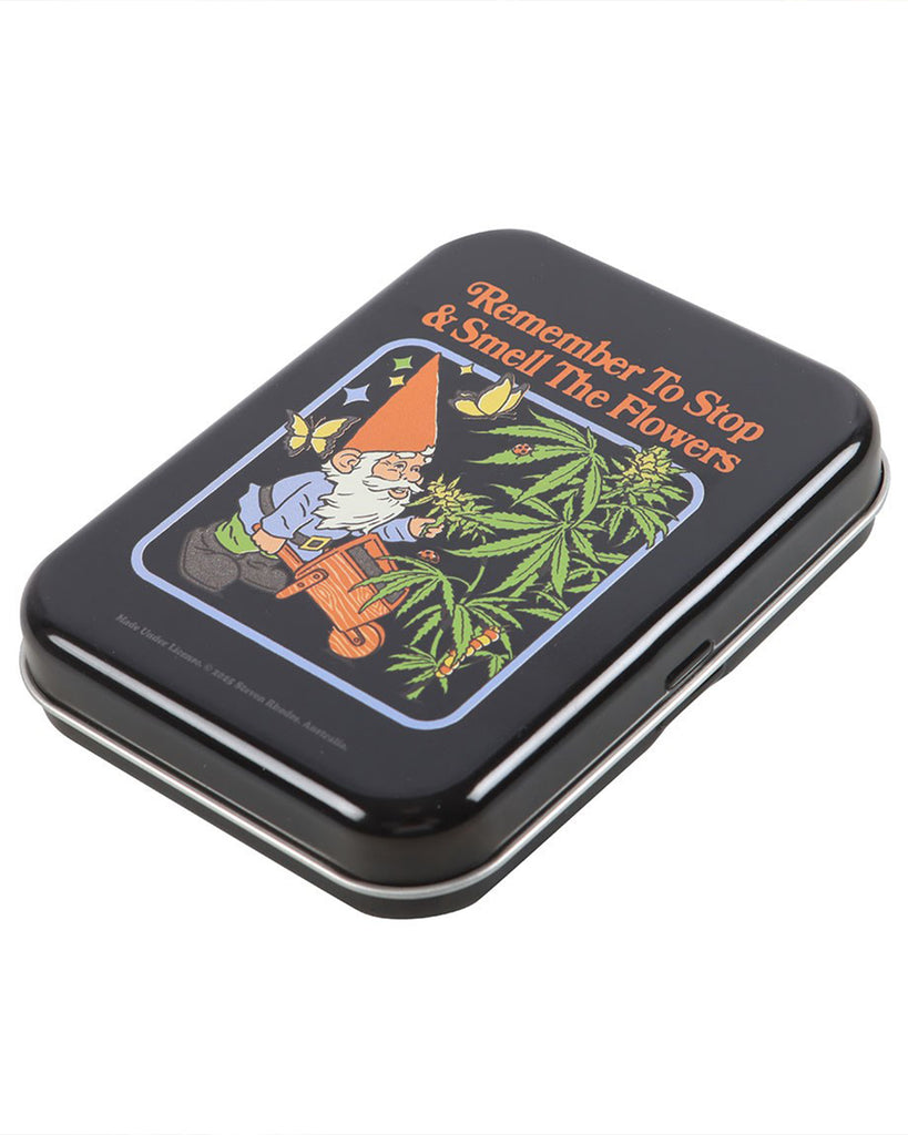 Angled side view of the Smell the Flowers stash tin by Steven Rhodes, showing the fun retro gnome artwork on the lid. Available at Rebel Romance, it’s a quirky yet functional storage solution.