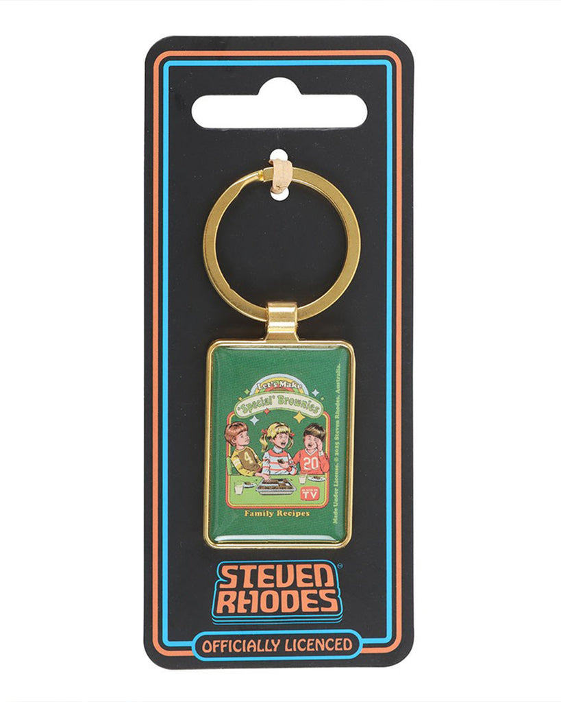 Rebel Romance Steven Rhodes 'Special' Brownies enamel keyring in packaging. Officially licensed quirky retro accessory with gold-tone frame and vintage-style baking design. Perfect alternative gift for fans of humour, nostalgia, and unique collectible accessories.