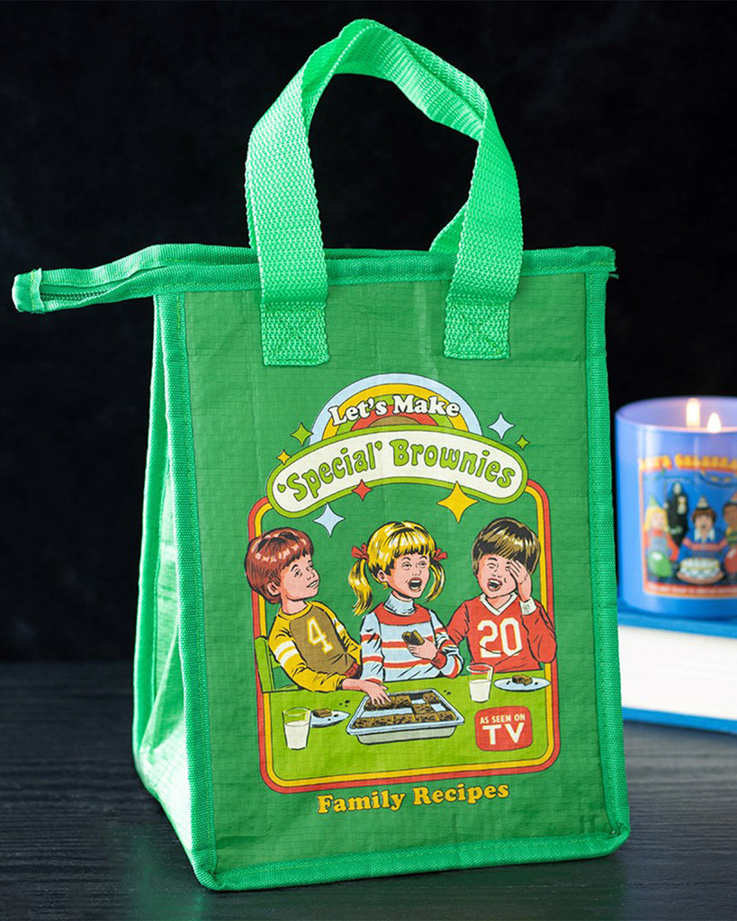 Rebel Romance insulated lunch bag featuring Steven Rhodes’ “Let’s Make Special Brownies” retro design. Made from recycled plastic with foil lining and zip closure, this quirky green bag is perfect for keeping food fresh while adding humour to lunchtime.
