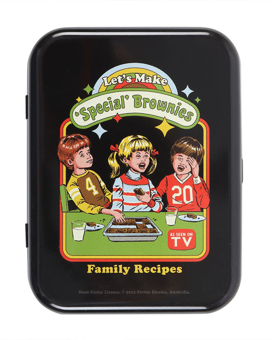 Front view of the Rebel Romance “Let’s Make Special Brownies” stash tin by Steven Rhodes. Features colourful retro-inspired artwork of three kids baking special brownies with the words “Family Recipes” and “As Seen on TV”. A cheeky and fun alternative gift for millennials who love unique homeware.