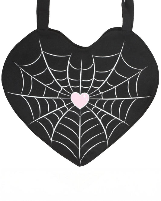 Heart-shaped black tote bag with a white spiderweb print and pastel pink heart in the centre. Designed by Rebel Romance, a UK brand specialising in gothic and alternative fashion accessories.