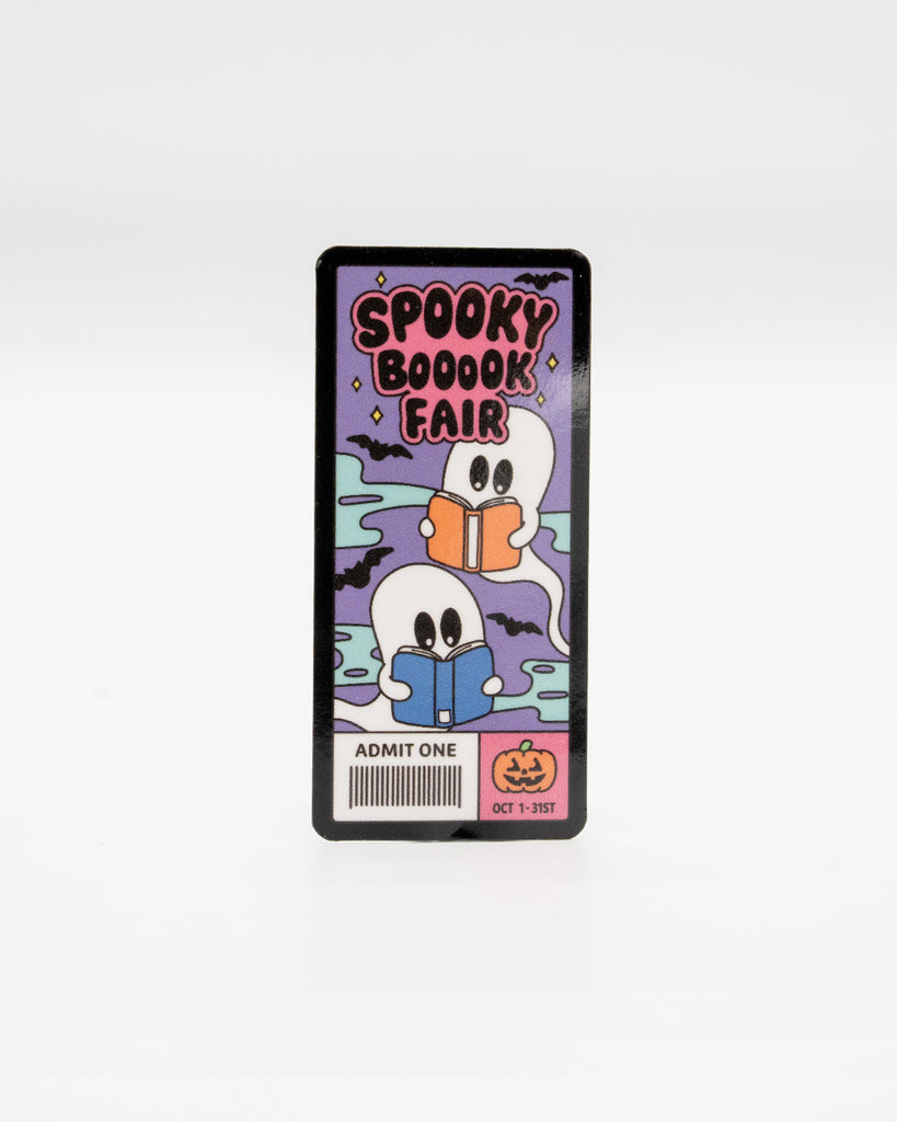 Cute rectangular vinyl sticker designed like a ticket with pastel ghosts reading books under a spooky sky. Features the text “Spooky Booook Fair” and “Admit One – Oct 1–31st” with a tiny pumpkin icon. A fun Halloween-themed design for readers and ghost lovers. Created by Rebel Romance, a small UK brand known for alternative style, spooky vibes, and millennial-friendly gifts and stationery.