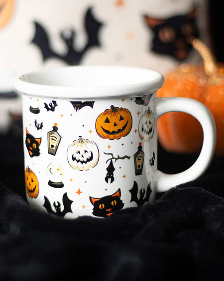 Close-up of the Spooky Cat and Pumpkin Print Mug, showing Halloween designs like jack-o'-lanterns, black cats, bats, and potion bottles on a white ceramic base. Ideal for coffee or tea lovers.