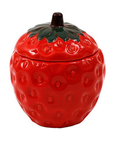 A glossy red strawberry-shaped candle pot with a removable lid, featuring realistic dimples and green leaves. Perfect for home decor or gifting, this scented candle from Rebel Romance fills any space with a sweet and fruity aroma.