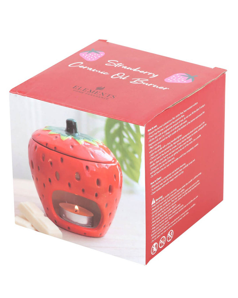 the box of Strawberry shaped oiler burner with lid on