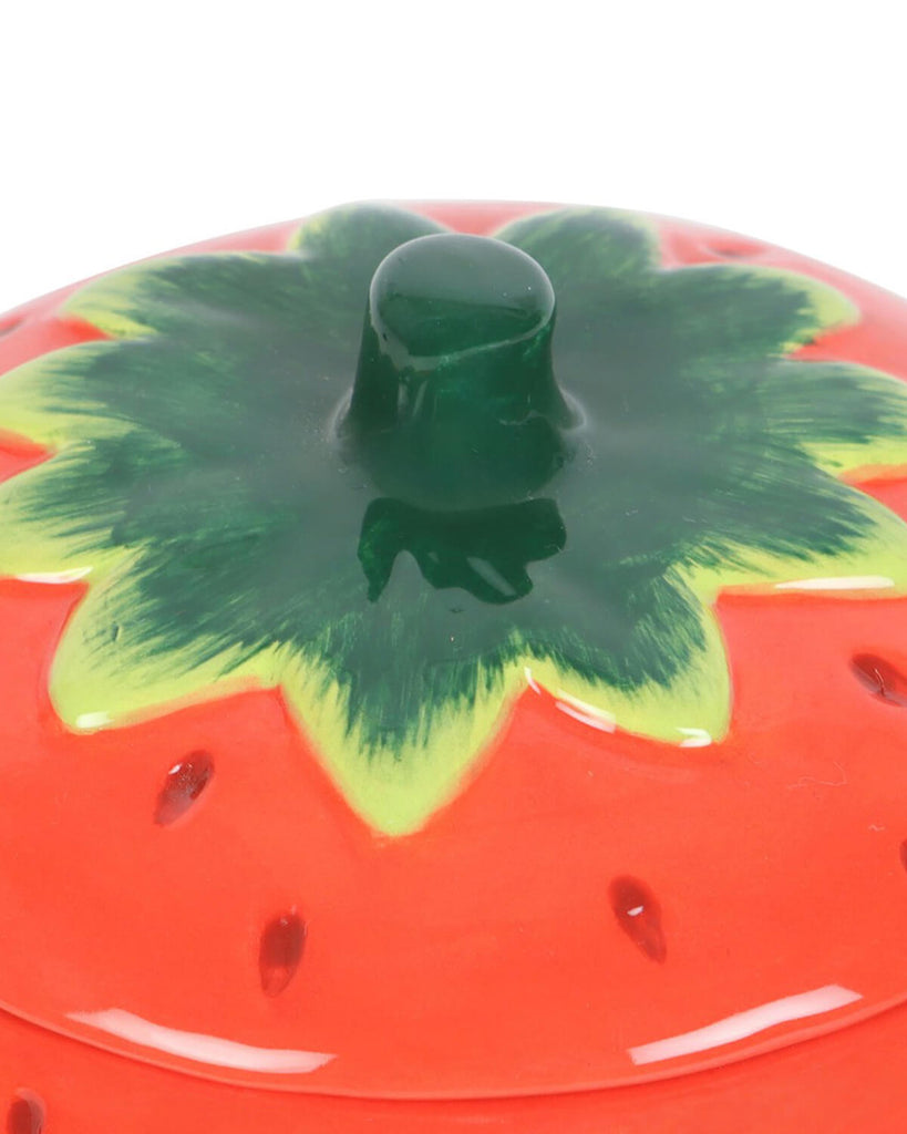 top of the lid of the Strawberry shaped oiler burner with lid on