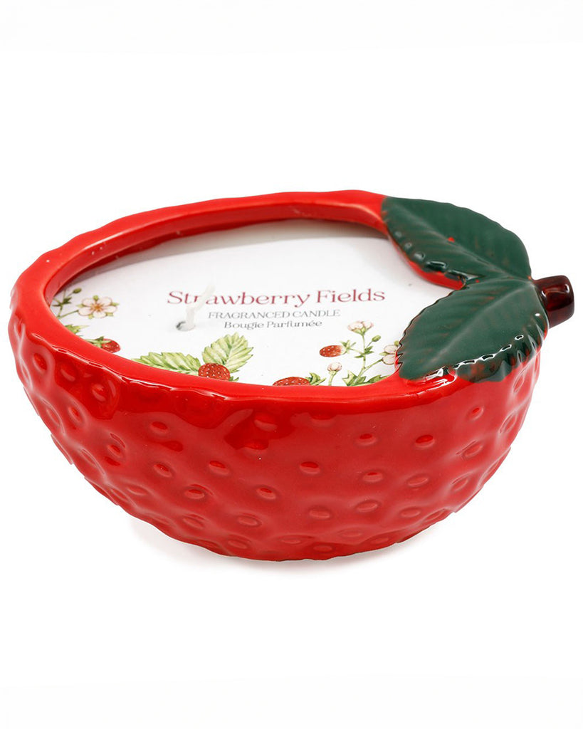 A vibrant, strawberry-shaped ceramic candlepot from Rebel Romance, filled with a Strawberry Fields fragranced candle. The red textured exterior mimics a real strawberry, while the top features green ceramic leaves for a cute, nature-inspired look. Once burned it can be used as a decorative strawberry tray.