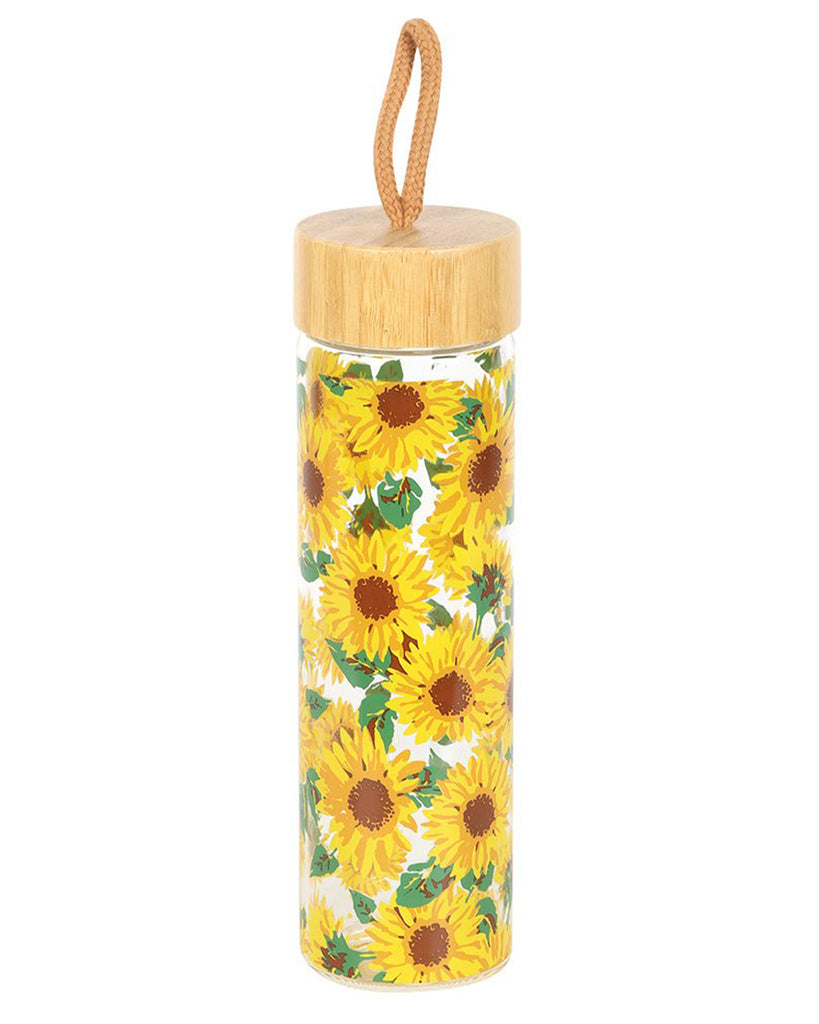 Front view of the Rebel Romance sunflower print water bottle. The 600ml glass bottle has an eye-catching sunflower design with green leaves, a bamboo screw-top lid, and a tan cord for easy carrying. Perfect for staying hydrated while showcasing your alternative, retro aesthetic.