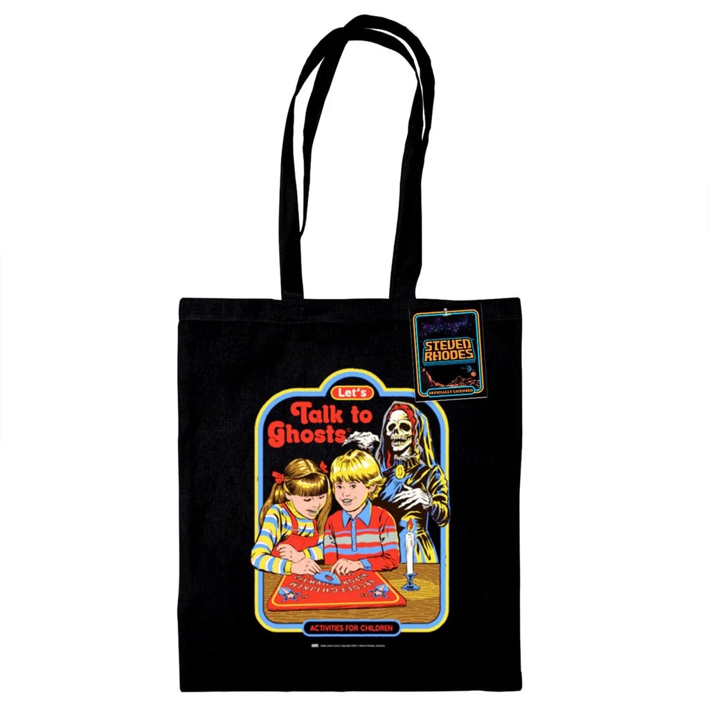 A black cotton tote bag featuring a retro-style Steven Rhodes design titled “Let’s Talk to Ghosts.” The illustration shows two children playing with a spirit board, with a skeleton ghost in the background. The vibrant design includes bold colours like red, yellow, and blue, paired with humorous text in a nostalgic comic-book style.