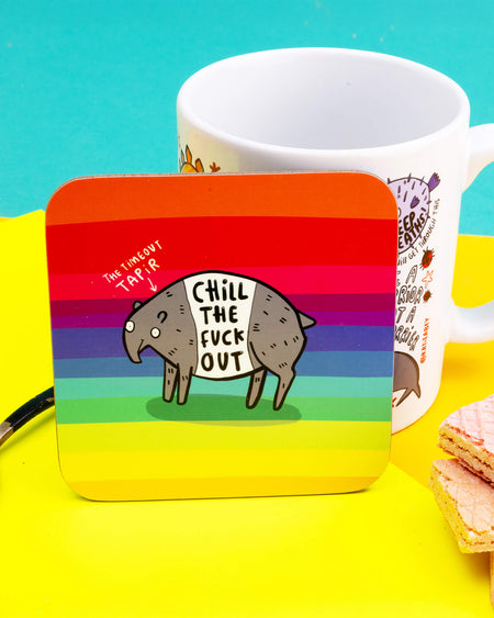 Square rainbow coaster featuring a cartoon tapir with the text “Chill the fuck out” written on its side. Designed by Katie Abey. Measures approx. 9cm with rounded corners. A humorous, sweary coaster perfect for desks, coffee tables or as a cheeky gift.