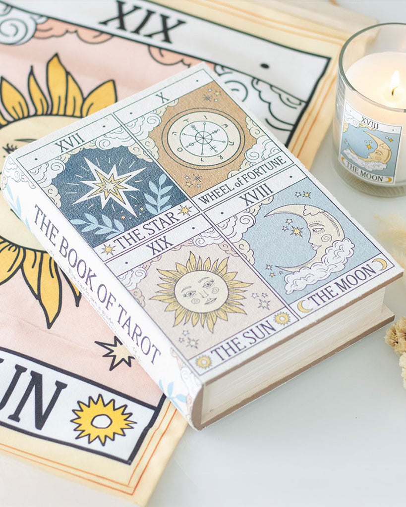 Styled flat lay featuring the Rebel Romance Book of Tarot storage box alongside a matching candle and cloth. A perfect witchy aesthetic setup for altars or mystical decor, ideal for storing keepsakes and jewellery.