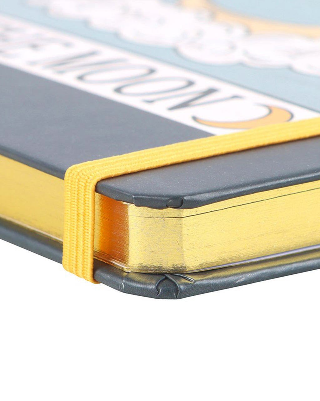 Close-up of The Moon tarot A5 notebook showing gold foiled pages and yellow elastic closure. Ideal for tarot journaling or spiritual note-taking.
