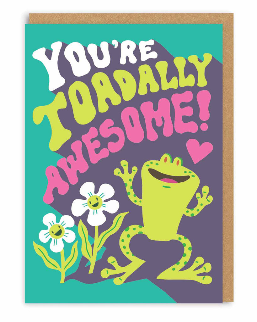 A6 greeting card featuring a happy green cartoon frog, white flowers, and the phrase “You’re Toadally Awesome!” in retro-style text with neon pink accents. Designed by Hello!Lucky and stocked by Rebel Romance, this card includes a brown kraft envelope. A fun and colourful card perfect for birthdays, thank you notes, and cheering someone on with playful, positive vibes.