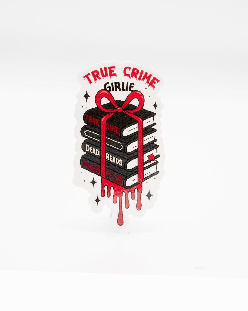 Die-cut vinyl sticker featuring a stack of black and red books tied with a ribbon, labelled “True Crime,” “Deadly Reads,” and “Murder Files,” with dripping blood details. The text “True Crime Girlie” sits at the top in bold red font. A dark and quirky design perfect for true crime fans. Created by Rebel Romance, a small UK brand celebrating alternative aesthetics and spooky millennial-friendly gifts.