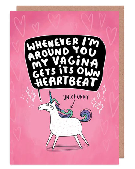  A sleazy looking white unicorn on a pink card with an arrow pointing to it saying 'UNICHORNY' Above that in a black speech bubble it says, 'Whenever I'm around you my vagina gets its own heartbeat.' It is on a pink card with hears and sparkles. Designed by Katie Abey