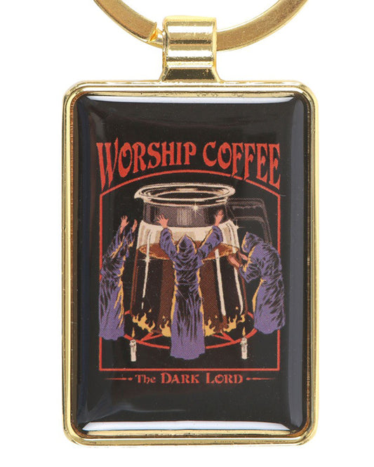Rectangular enamel keyring with a gold frame featuring Steven Rhodes’ retro gothic design. The artwork shows robed figures worshipping a giant coffee pot, with text reading “Worship Coffee – The Dark Lord.” Available at Rebel Romance, a UK brand celebrating alternative fashion, gifts, and quirky homeware.