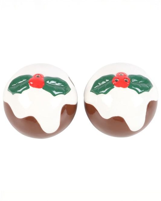 Top-down view of two ceramic Christmas pudding shakers featuring red berries and green holly leaves on white glazed icing.